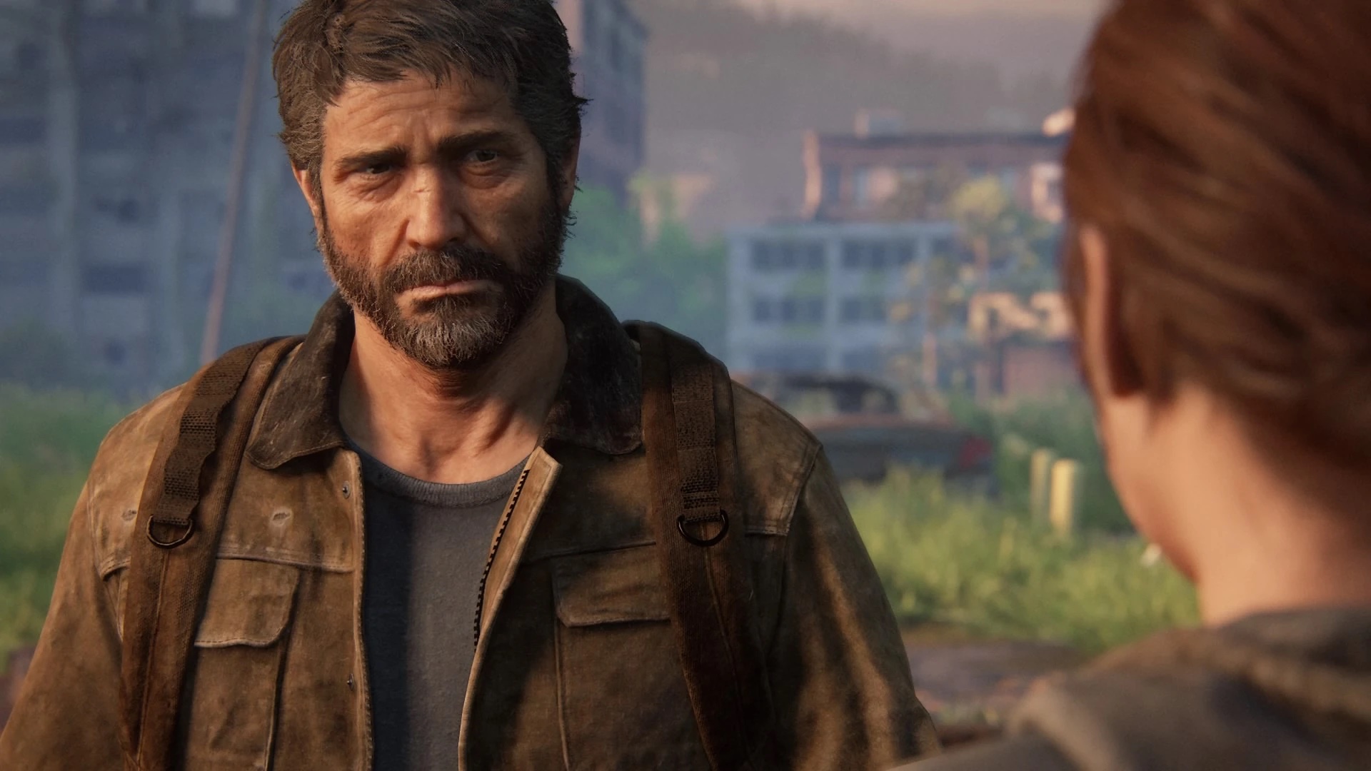 Joel looking at Ellie